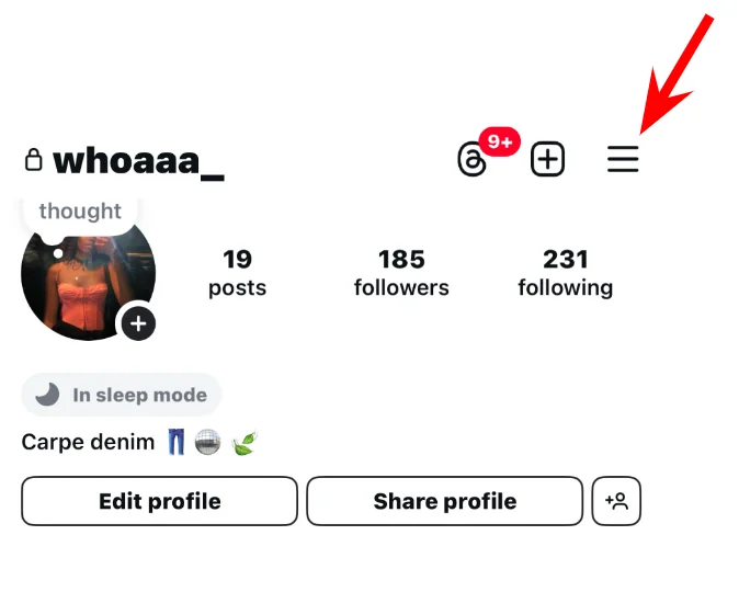 Arrow pointing to the menu icon at the top right of an Instagram profile.