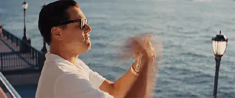 Leonardo DiCaprio in The Wolf of Wall Street flicking cash, leading into Meta Verified pricing